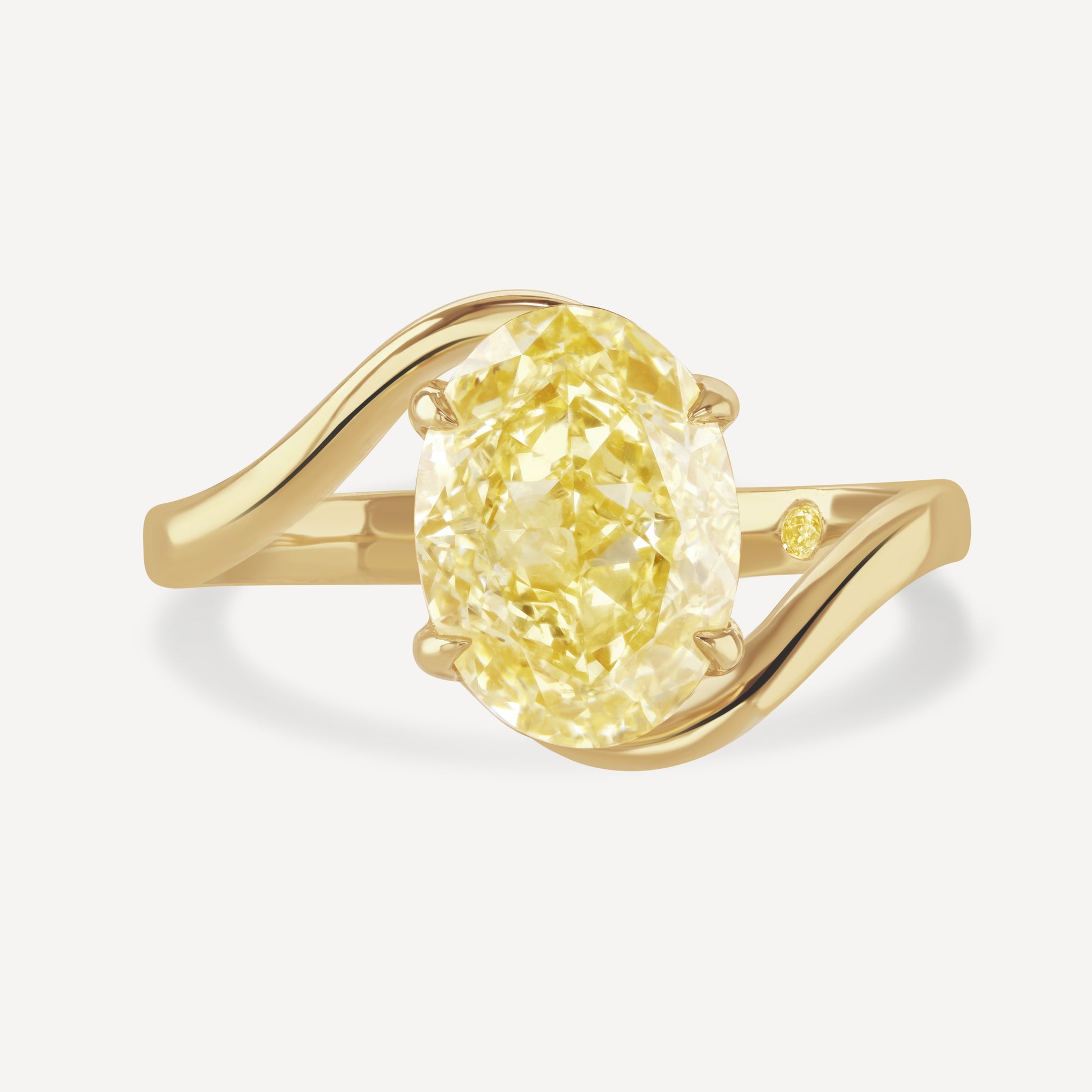 Close up of 3 carat yellow oval-cut lab-grown diamond Glow Float Ring against white background