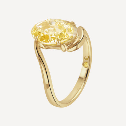 Side view close up of 3 carat yellow oval-cut lab-grown diamond Glow Float Ring against white background