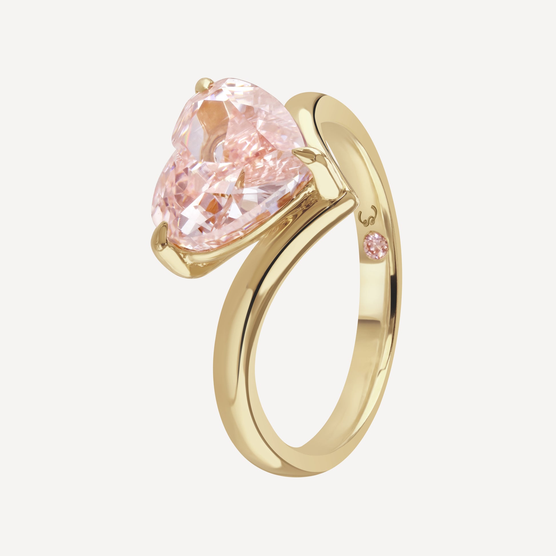 Side profile close up of 3 carat pink heart-cut lab-grown diamond Muse Float Ring against white background