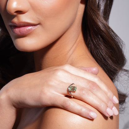 Model wearing the Poise Float Ring with 3 carat green emerald-cut lab-grown diamond